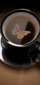 Coffee cup wallpaper with butterfly latte art.