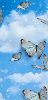 Butterflies fluttering in a bright blue sky with soft clouds.