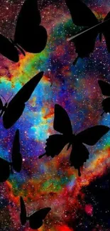 Colorful galaxy with butterfly silhouettes wallpaper.