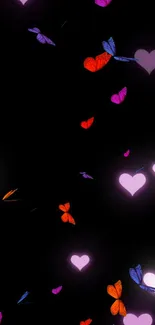 Colorful glowing butterflies and hearts on a dark background wallpaper.