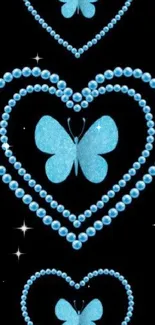 Blue butterflies and pearls form hearts on a black background for mobile wallpaper.