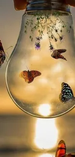 Butterflies inside a glowing light bulb set against a sunset sky.