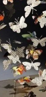 Butterflies crafted from book pages flying from an open book.