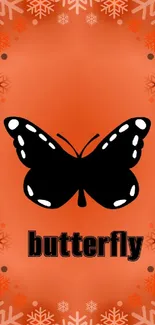 Orange wallpaper with black butterfly and snowflakes.