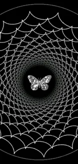 Butterfly in a detailed spiderweb pattern on a black background wallpaper.