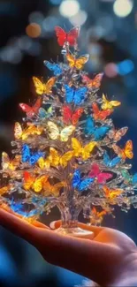 A magical butterfly tree held in a hand with vibrant colors.