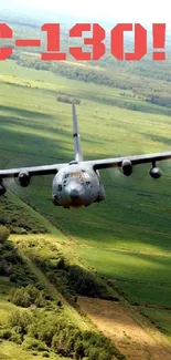 C-130 airplane flying over lush green fields.