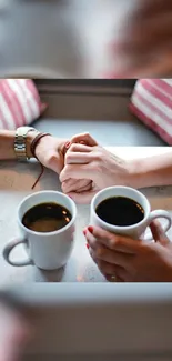 Romantic mobile wallpaper with hands and coffee cups.