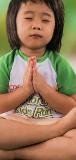 Child meditating in a calming green setting.