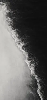 Monochrome ocean waves crashing gently.