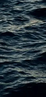 Mobile wallpaper of navy blue ocean waves creating a serene and calming effect.