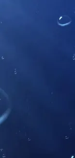 Serene blue wallpaper with floating bubbles.