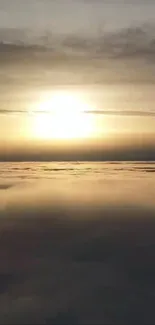 Golden sunset over a sea of clouds viewed from above.