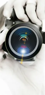 Artistic mobile wallpaper featuring a camera lens close-up.