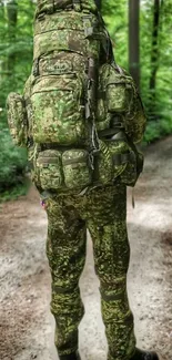 Camouflaged hiker on a forest trail with lush green scenery.