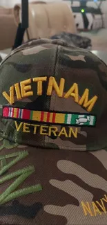 Camo Vietnam Veteran cap with military design.