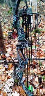 Camouflage compound bow in autumn forest.