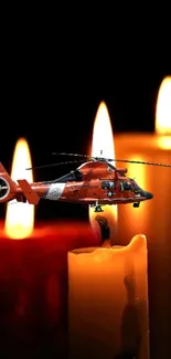 Orange helicopter, glowing candles, dark background.