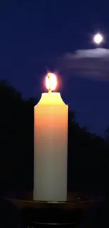 Candle flickering against a moonlit night sky.