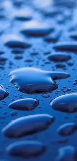 Close-up of blue water droplets on a smooth surface, creating a serene background.