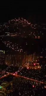 City skyline with fireworks bursting in the dark night sky.