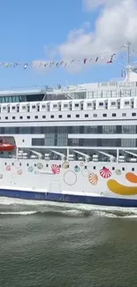 Luxurious cruise ship sailing on a sunny day.