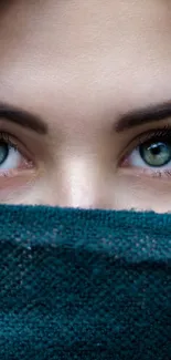 Close-up of captivating teal-covered eyes.