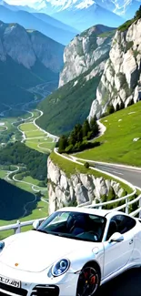 White car on a winding scenic mountain road with lush green landscape.