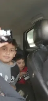 Kids inside a car during a family trip, offering a warm and cozy view.