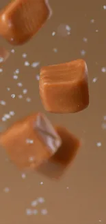 Floating caramel cubes with sugar particles in light brown.