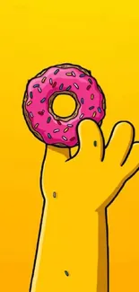 Cartoon hand holding pink sprinkled donut on yellow background.