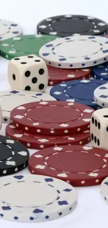 Assortment of colorful poker chips and dice on a white background.