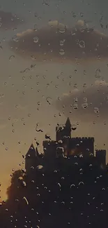 Castle silhouette in rain drops at sunset.