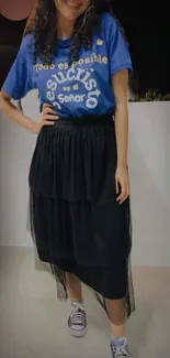 Casual outfit with blue tee and black skirt, perfect for stylish inspirations.