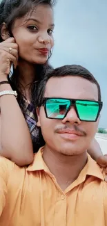 Vibrant young couple outdoors taking a selfie.