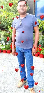 Casual portrait in a vibrant garden with flowers and greenery.