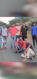 Group of friends posing casually on a country road.