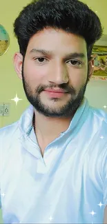 Casual indoor portrait of a smiling man in white shirt.