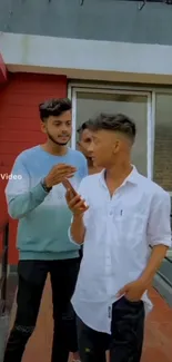 Three friends in stylish attire chatting outdoors.