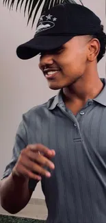 Casual style person with a cap outdoors.