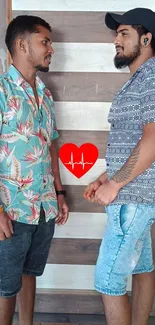 Two friends in casual shirts with a heart design in between.