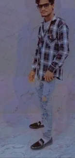 Casual urban fashion wallpaper with a man in plaid and ripped jeans.