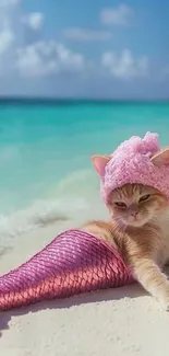 A cat dressed as a mermaid sunbathing on a sandy beach.