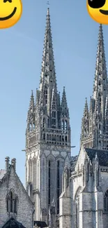 Cathedral with emojis wallpaper featuring spires and a blue sky background.