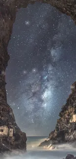 Cave opening framing a starry night sky and Milky Way over water.