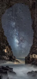 Cave opening reveals starry night sky over rocky coastline.