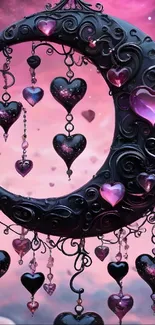 Crescent moon with heart jewels in a pink sky.