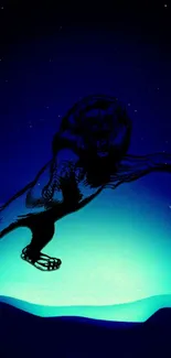 Majestic leaping lion in blue night sky wallpaper with stars.