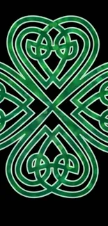 Celtic knot green design on black wallpaper.