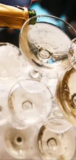 Close-up of champagne being poured into elegant glasses, creating a sparkling effect.